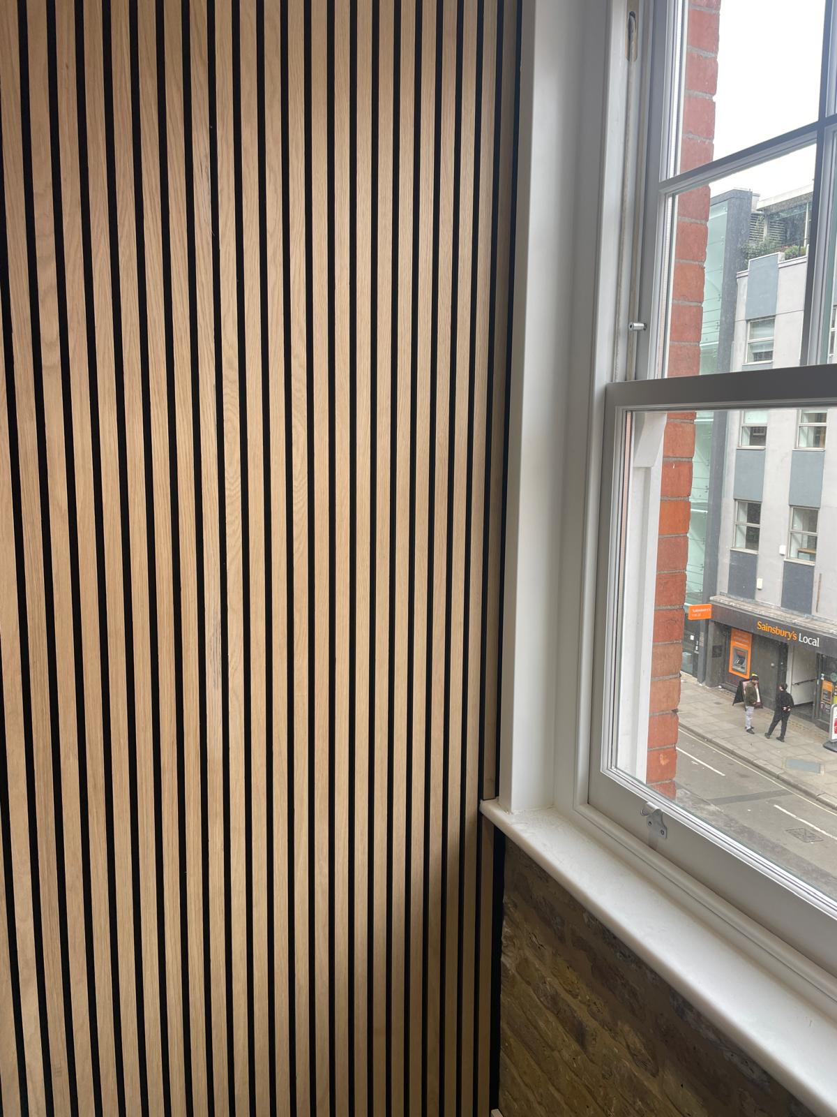 Acoustic wood wall panel installation detail in NW1 London