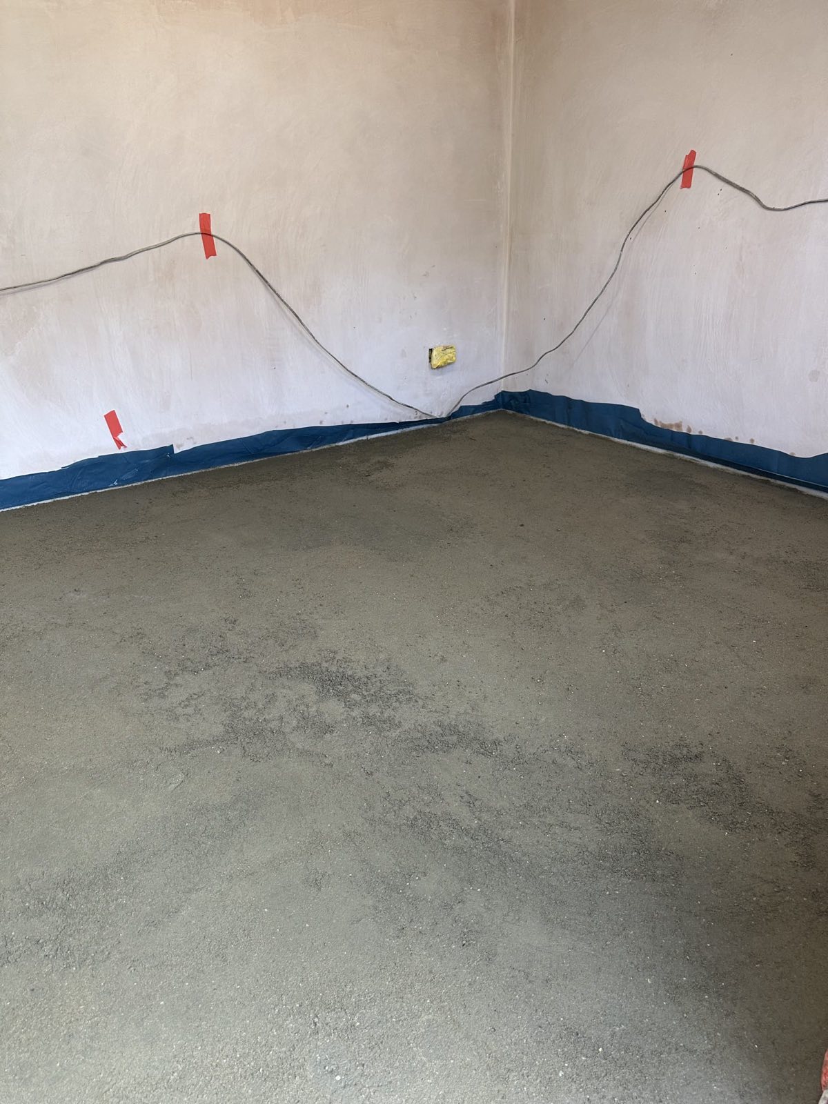 Finished screed floor in a garage conversion in Hendon NW4